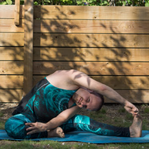 Revolved Head to Knee Pose in June 23rd 2018. I entered this from  Janu Sirsasana, the forwardfold with head to knee, and reached for the other knee. I have hard to smile in this one, like in